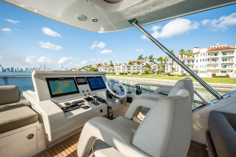 Slide: The Image of Luxurious 2017 Azimut 66 yacht helm with scenic waterfront view. - 44