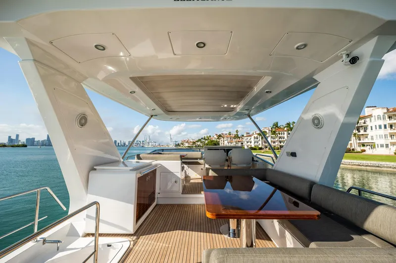 Slide: The Image of Luxurious 2017 Azimut 66 yacht deck with seating, table, and ocean view. - 46