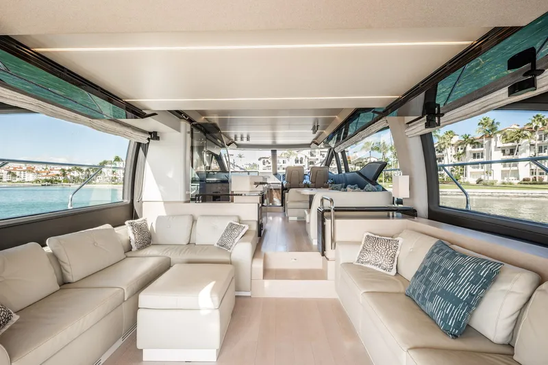 Slide: The Image of Luxurious interior of 2017 Azimut 66 yacht with elegant seating and panoramic windows. - 6