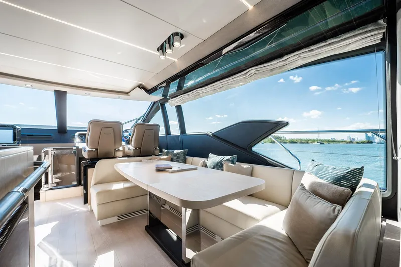 Slide: The Image of Luxurious interior of 2017 Azimut 66 yacht with elegant seating and scenic water view. - 9