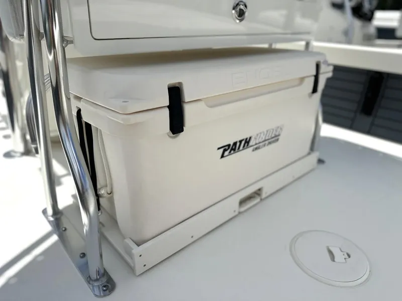 Slide: The Image of 2025 Pathfinder 2500 Hybrid boat cooler with secure latches on deck. - 11