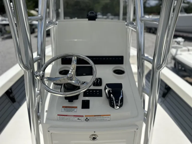 Slide: The Image of 2025 Pathfinder 2500 Hybrid boat console with steering wheel and controls. - 12