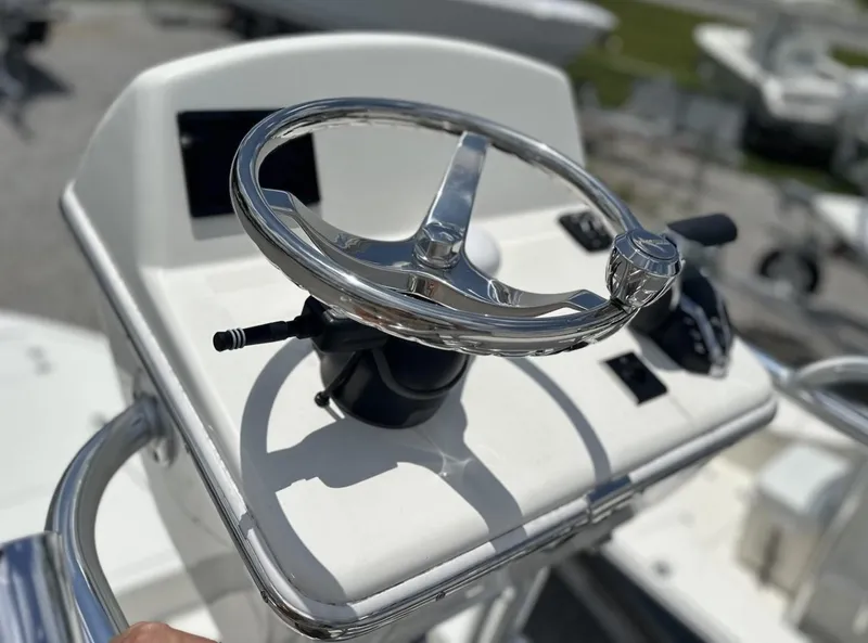 Slide: The Image of Steering console of 2025 Pathfinder 2500 Hybrid boat, featuring modern controls and sleek design. - 13