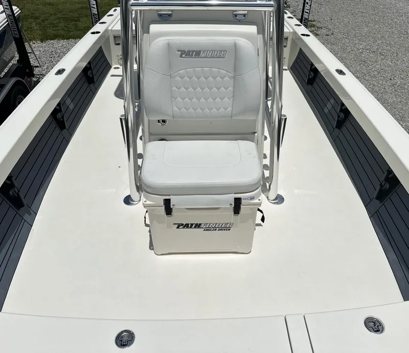 Slide: The Image of 2025 Pathfinder 2500 Hybrid boat interior with white seating and storage. - 17
