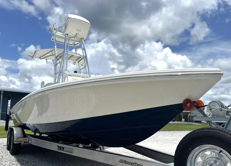 Slide: The Image of 2025 Pathfinder 2500 Hybrid boat on trailer under cloudy sky. - 7