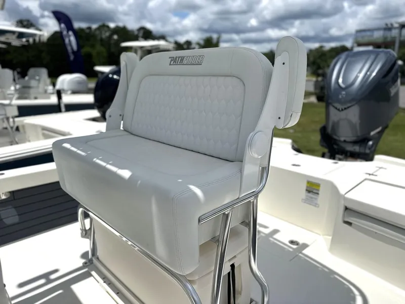 Slide: The Image of 2025 Pathfinder 2500 Hybrid boat seat with white upholstery and stainless steel frame. - 9