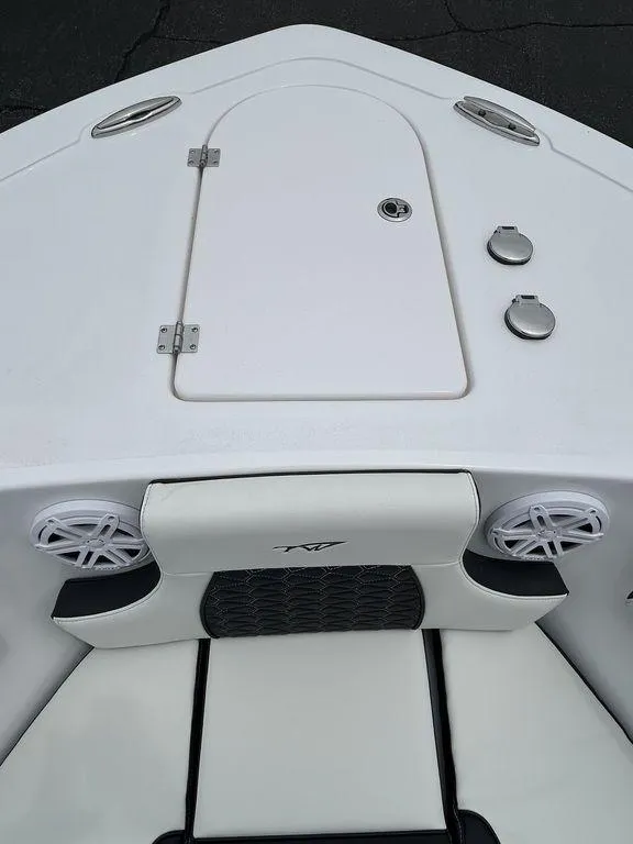 Slide: The Image of 2025 Tidewater 232 LXF boat bow with storage hatch and speakers. - 10