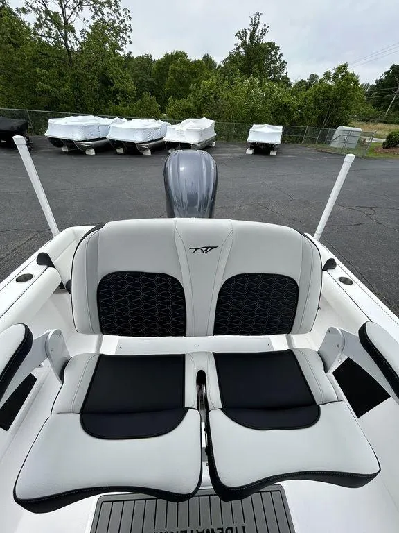 Slide: The Image of 2025 Tidewater 232 LXF boat interior with sleek seating and modern design. - 12