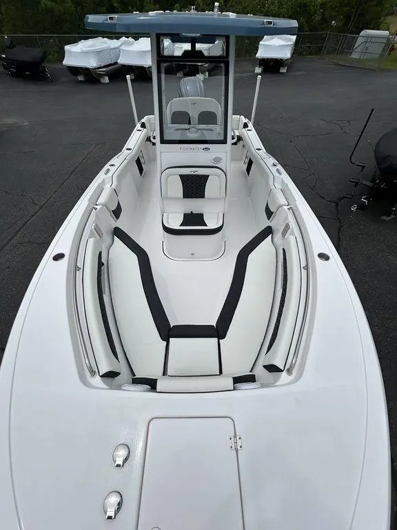 Slide: The Image of 2025 Tidewater 232 LXF boat with sleek white interior and modern design. - 6