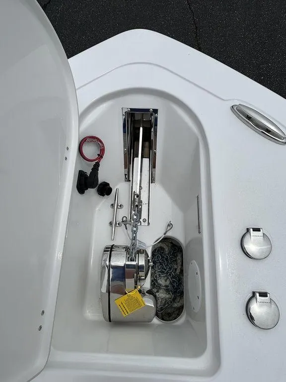 Slide: The Image of 2025 Tidewater 232 LXF boat anchor compartment with chain and accessories. - 7