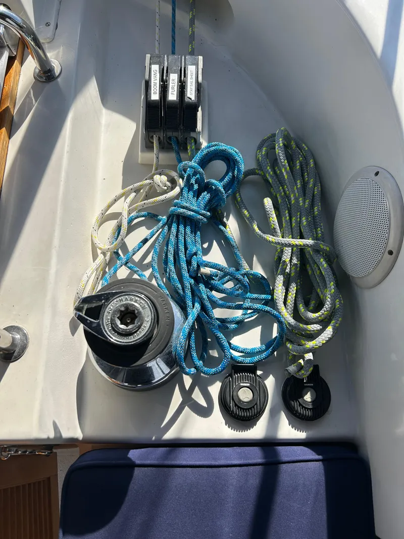 Slide: The Image of Sailing equipment on a 2004 Passport 470 yacht, featuring ropes and winches. - 30