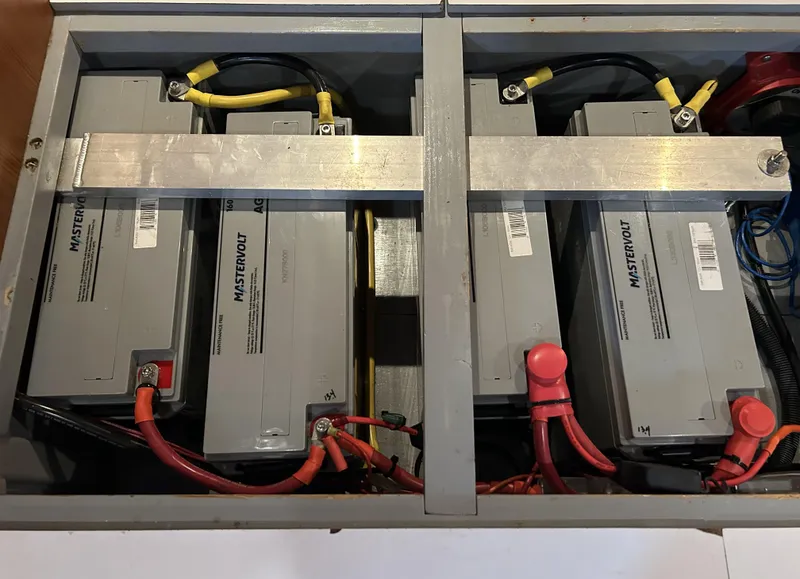Slide: The Image of Battery compartment of a 2004 Passport 470 with Mastervolt batteries and wiring. - 37