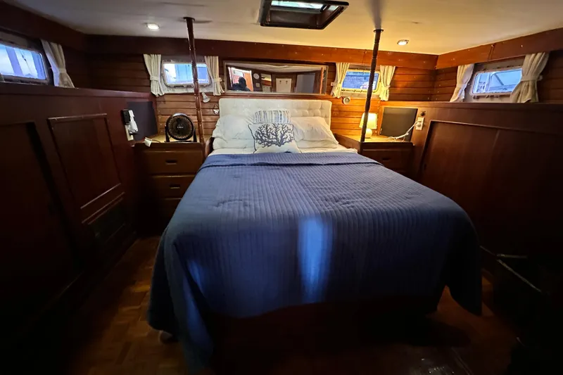 Slide: The Image of Cozy bedroom in 1980 Island Gypsy Flush Aft Deck Trawler-Motor Yacht with wood paneling. - 44