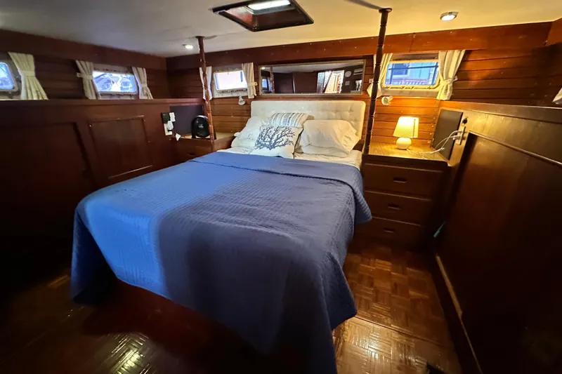 Slide: The Image of Cozy bedroom in 1980 Island Gypsy Flush Aft Deck Trawler-Motor Yacht with wooden interior. - 53