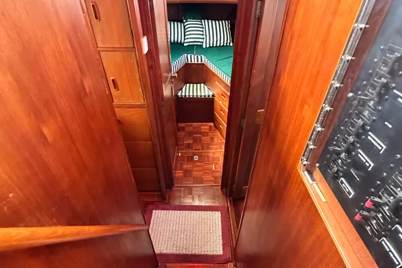 Slide: The Image of Interior of 1980 Island Gypsy Flush Aft Deck Trawler-Motor Yacht with wood paneling and cozy cabin. - 56