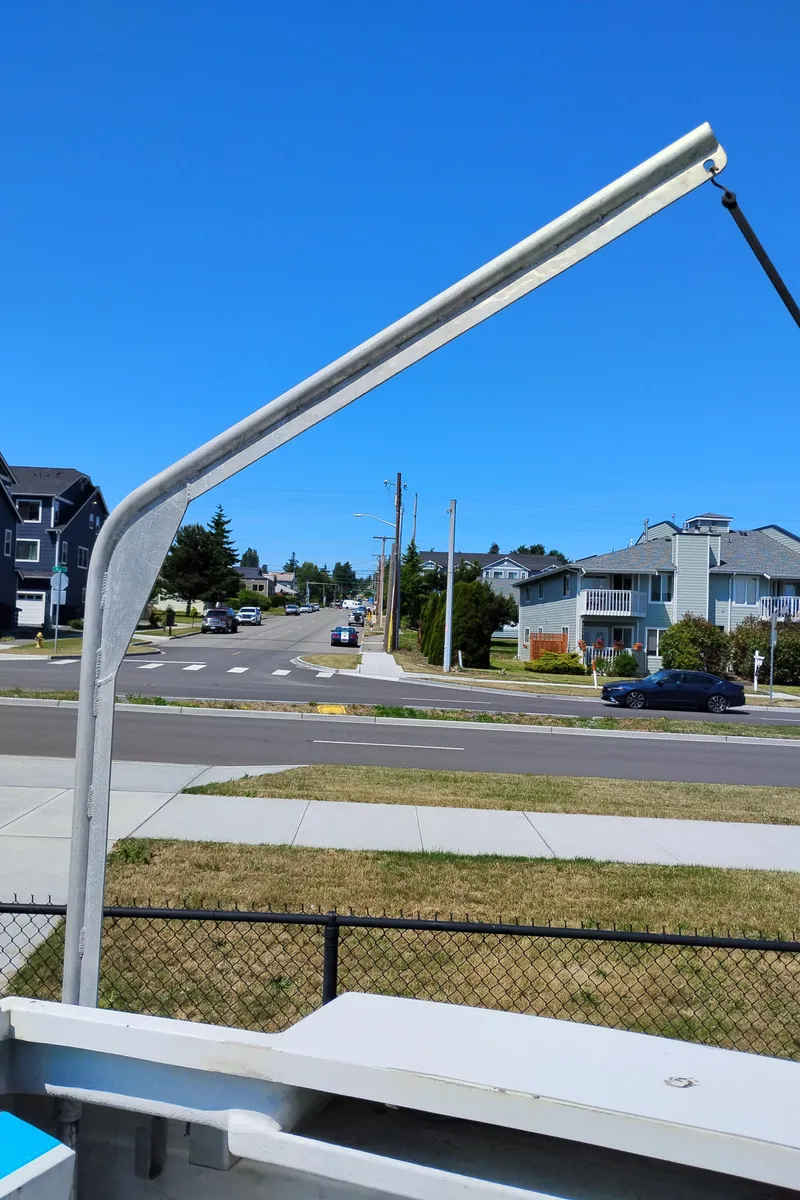 Slide: The Image of Street view with modern homes and a Martin Trunk Cabin, 1996, in the foreground. - 10
