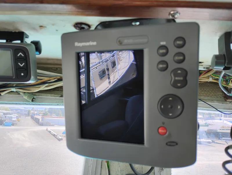 Slide: The Image of Raymarine navigation display inside a 1996 Martin Trunk Cabin boat, showing docked vessels. - 21