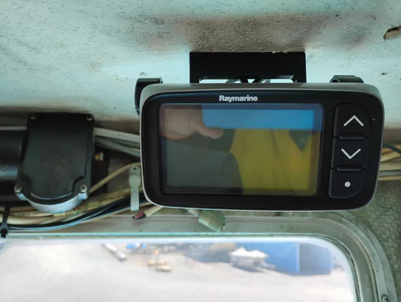 Slide: The Image of Raymarine device inside 1996 Martin Trunk Cabin, mounted on ceiling with visible wiring. - 24