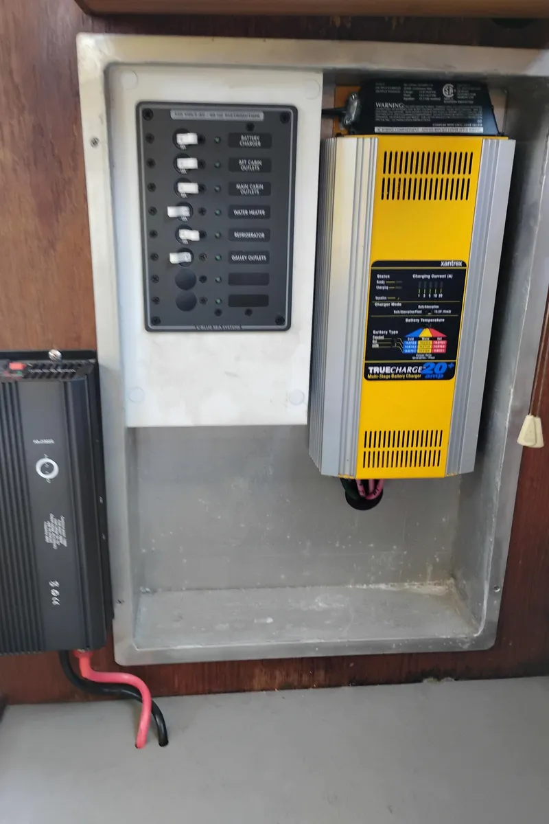 Slide: The Image of Electrical panel and charger in a 1996 Martin Trunk Cabin boat. - 30
