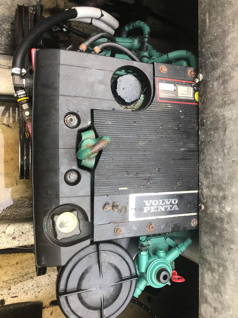 Slide: The Image of Volvo Penta engine in a 1996 Martin Trunk Cabin boat, showing wiring and components. - 33