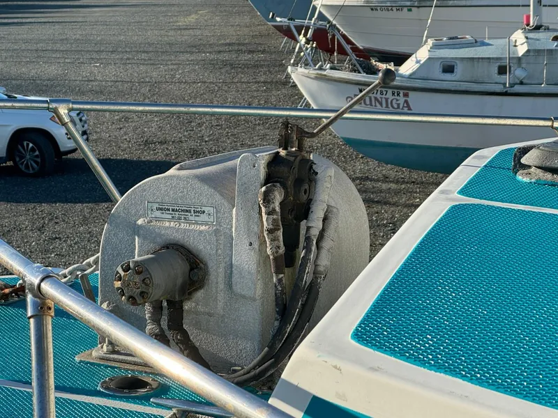 Slide: The Image of Boat deck with winch system, Martin Trunk Cabin 1996, parked sailboats in background. - 6