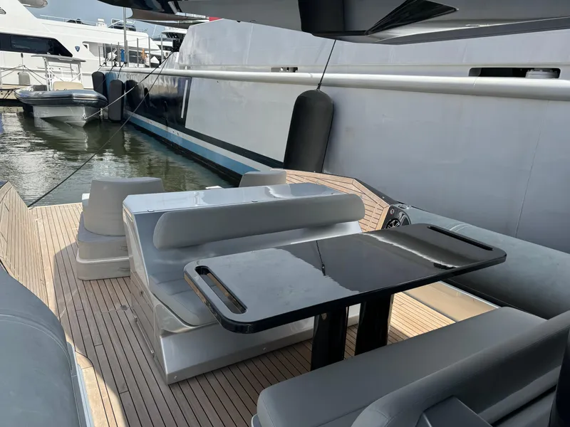 Slide: The Image of Luxury Anvera 42 yacht deck with sleek seating and table, 2022 model. - 4