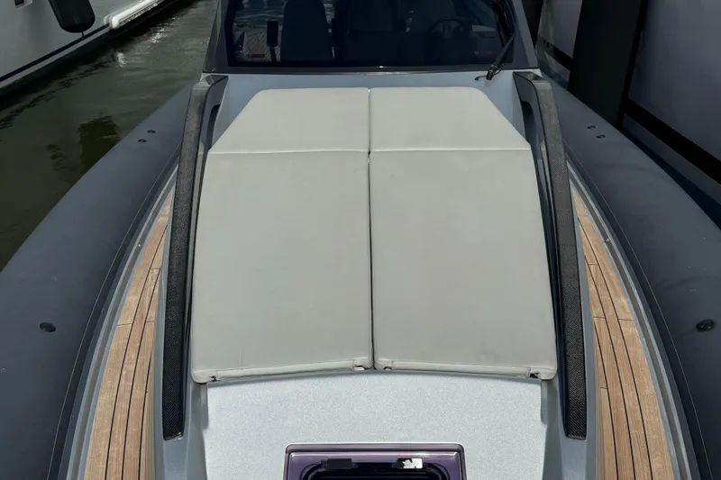 Slide: The Image of 2022 Anvera 42 boat deck with cushioned seating and sleek design. - 6