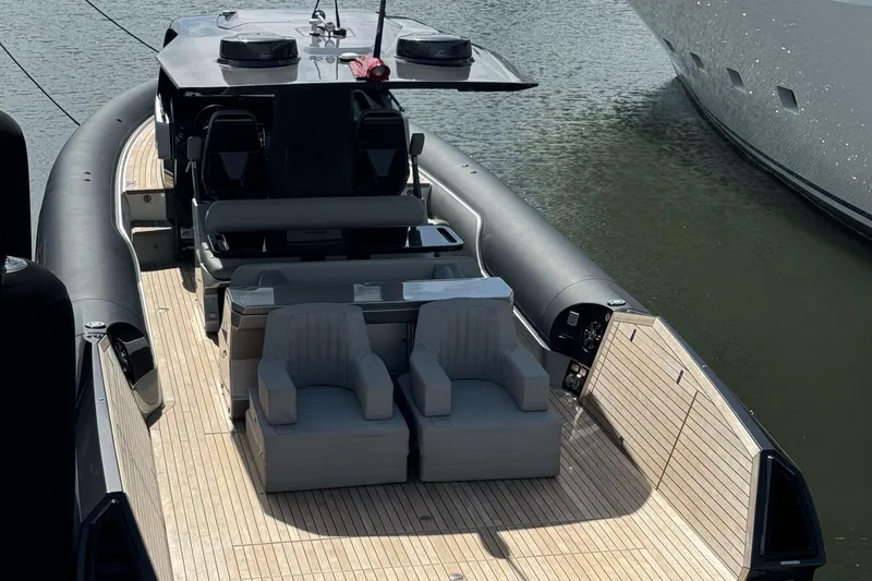 Slide: The Image of Anvera 42 boat, 2022 model, with sleek design and spacious deck, docked on water. - 7