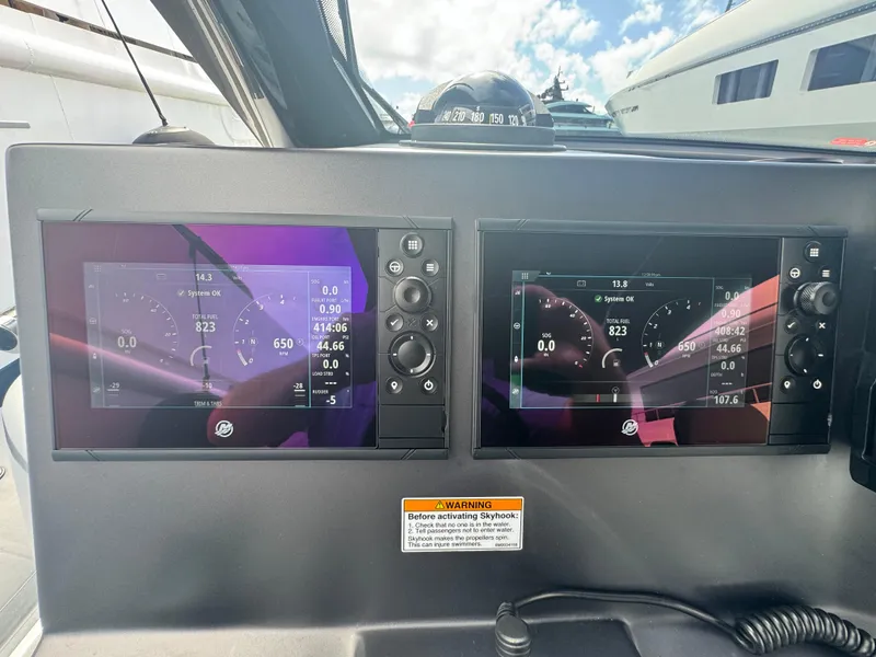 Slide: The Image of Dashboard of 2022 Anvera 42 boat with dual navigation screens and controls. - 8
