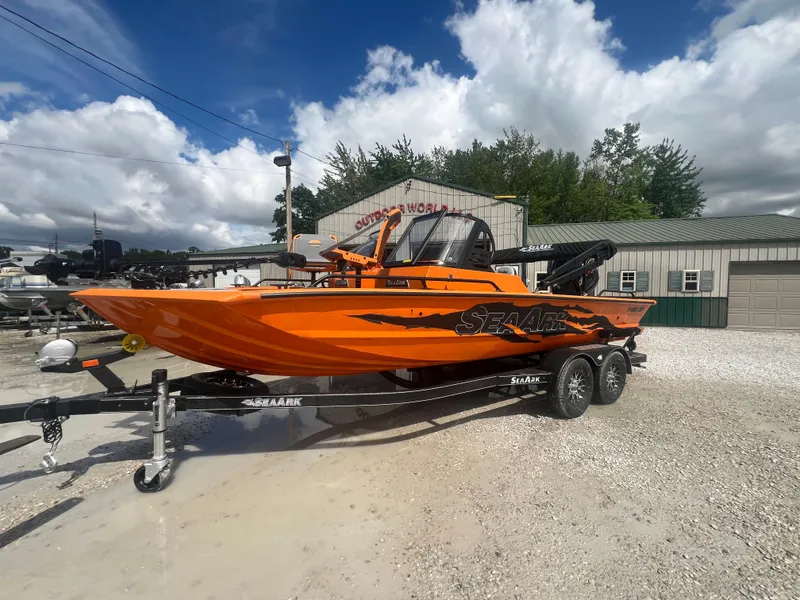 Slide: The Image of 2025 SeaArk ProCat 200 interior with plastic-covered seats and illuminated dashboard. - 3