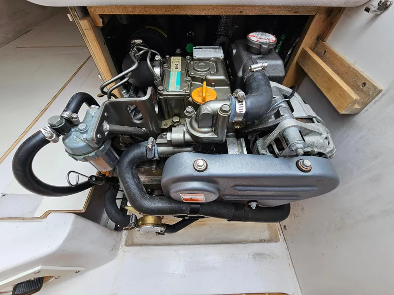 Slide: The Image of Engine compartment of a 2015 Catalina 275 Sport sailboat, showcasing detailed mechanical components. - 10