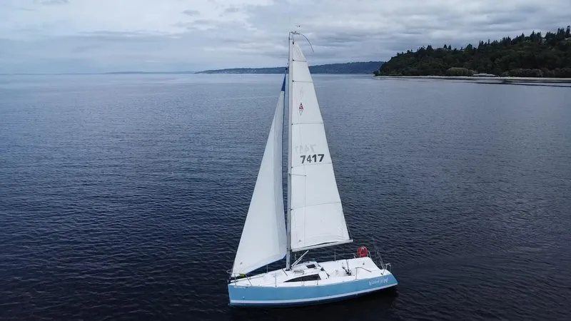 Slide: The Image of Sailboat Catalina 275 Sport 2015 on calm waters under cloudy sky. - 13