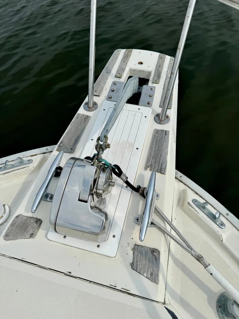 Slide: The Image of 1986 Silverton 34 Convertible Flybridge boat deck with anchor and winch system. - 17