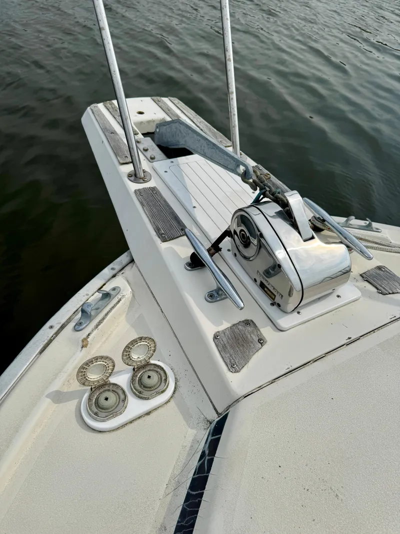 Slide: The Image of 1986 Silverton 34 Convertible Flybridge boat deck with anchor and winch system. - 18