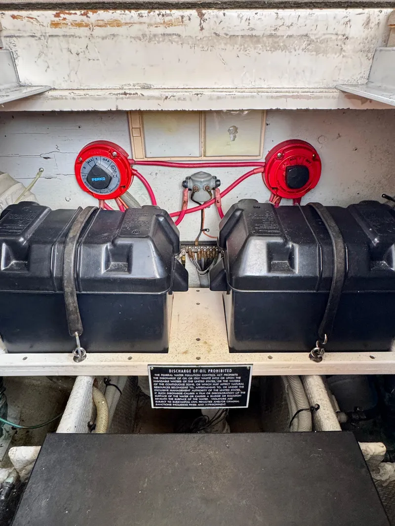 Slide: The Image of Engine compartment of 1986 Silverton 34 Convertible Flybridge with dual battery setup. - 32