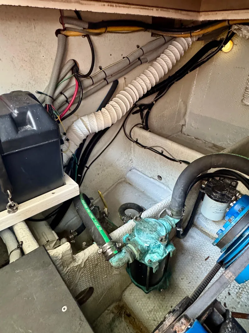 Slide: The Image of Engine room of 1986 Silverton 34 Convertible Flybridge with visible wiring and components. - 36