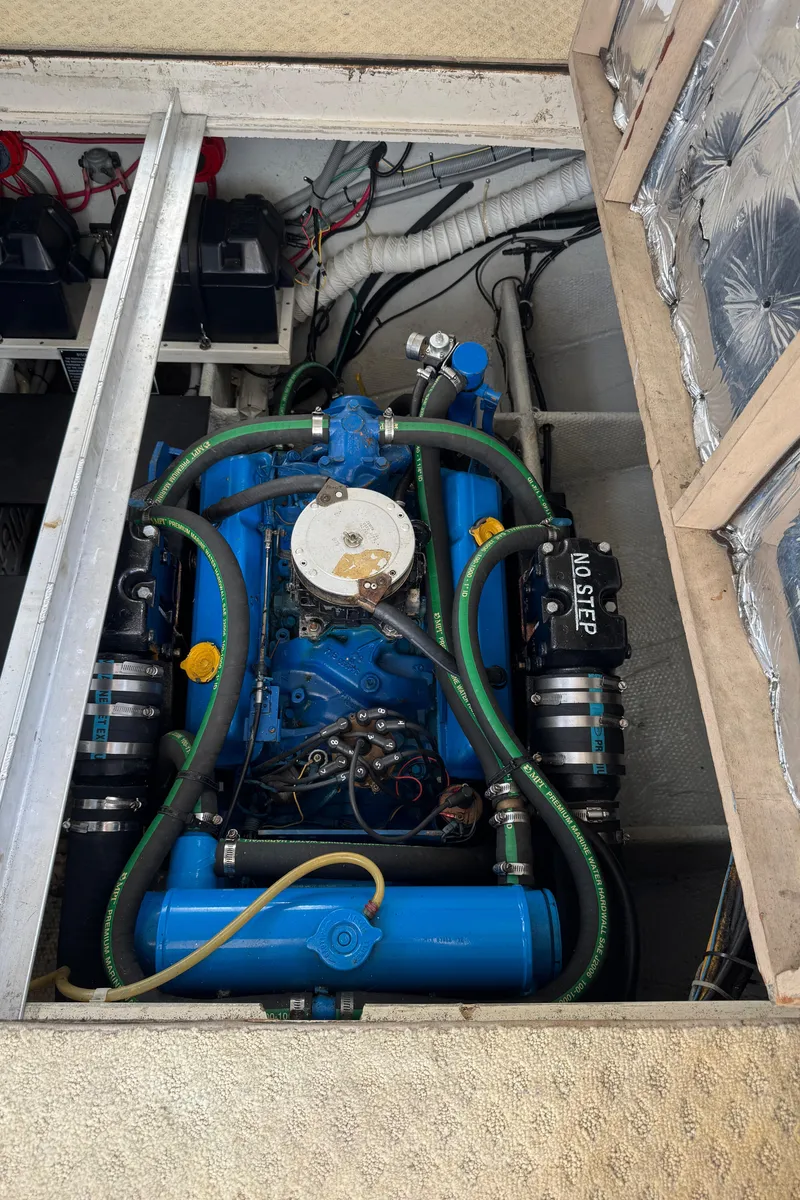 Slide: The Image of Engine compartment of a 1986 Silverton 34 Convertible Flybridge boat, showcasing detailed components. - 38