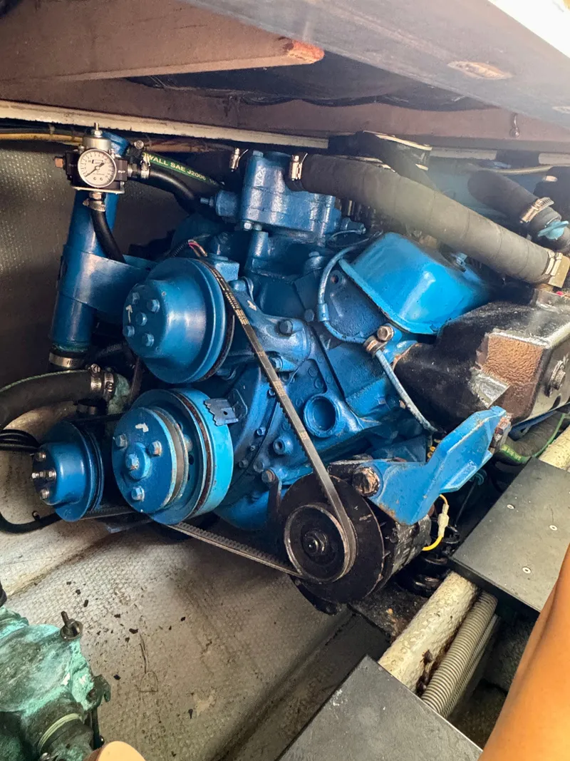 Slide: The Image of Engine of 1986 Silverton 34 Convertible Flybridge, showcasing blue components and mechanical details. - 41