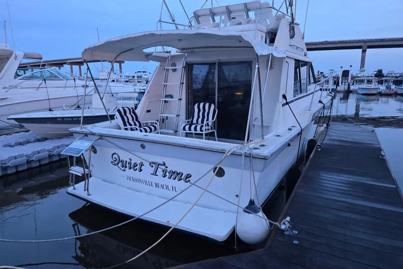 Slide: The Image of 1986 Silverton 34 Convertible Flybridge docked at marina, Jacksonville Beach, FL. - 5