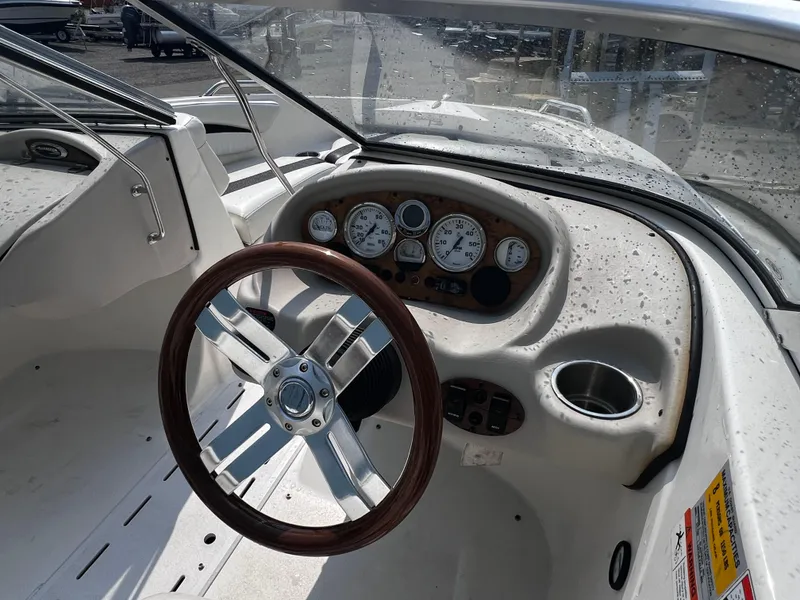 Slide: The Image of 2009 Glastron GT 185 boat dashboard with steering wheel and instrument panel. - 5