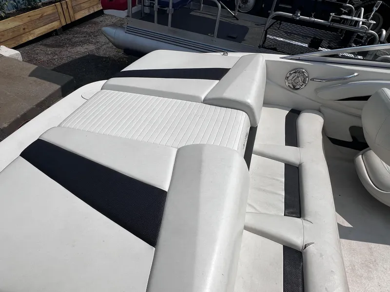 Slide: The Image of 2009 Glastron GT 185 boat interior with white and black seating. - 7