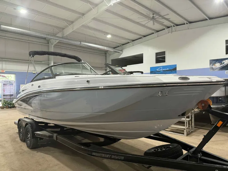 The Image of 2025 Monterey M4 boat on trailer in indoor showroom setting. - 0