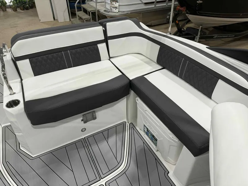 Slide: The Image of 2025 Monterey M4 boat interior with sleek black and white seating design. - 6