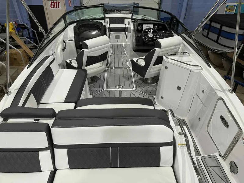 Slide: The Image of 2025 Monterey M4 boat interior with sleek seating and modern dashboard design. - 7