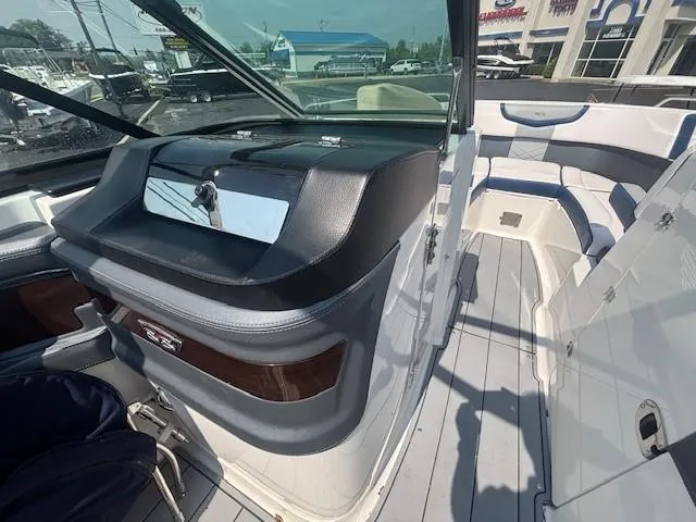 Slide: The Image of Interior of 2020 Chaparral 257 SSX boat with compact bathroom and window. - 14
