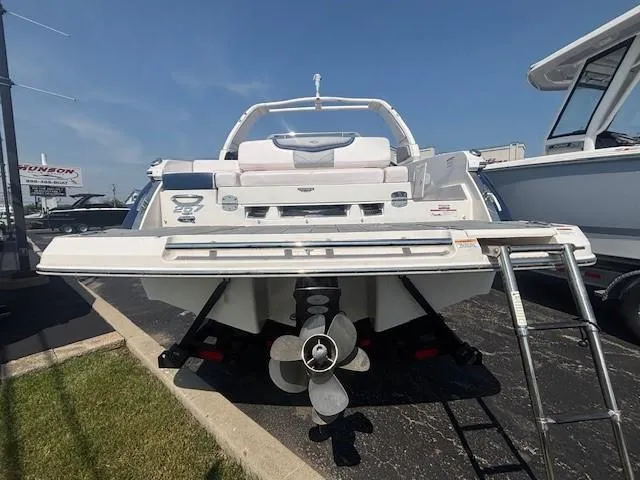 Slide: The Image of 2020 Chaparral 257 SSX boat interior with white and blue seating, modern design. - 16