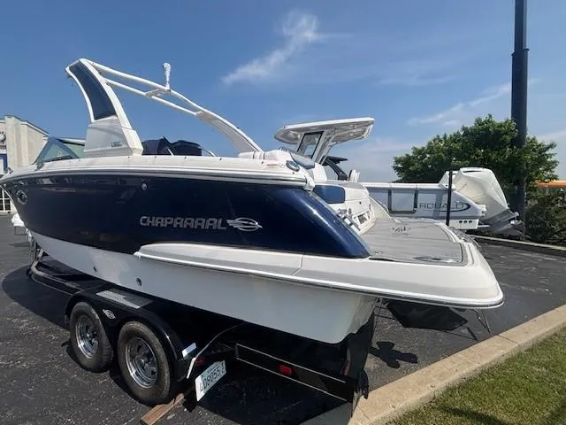 Slide: The Image of 2020 Chaparral 257 SSX boat interior with sleek dashboard and spacious seating. - 17