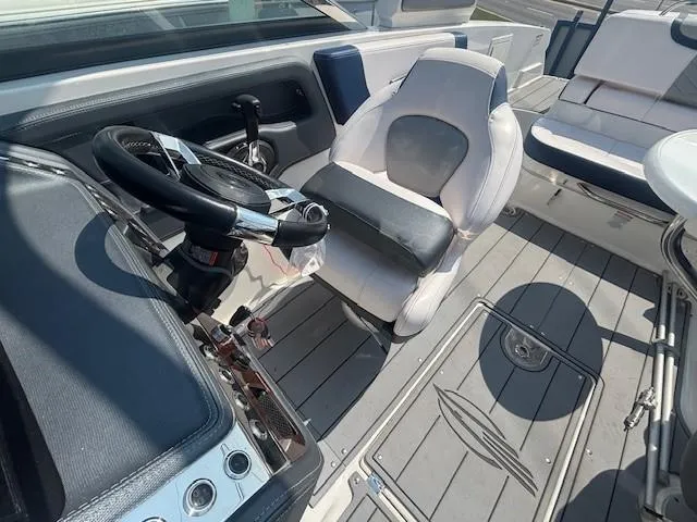 Slide: The Image of 2020 Chaparral 257 SSX boat cockpit with steering wheel and control panel. - 5
