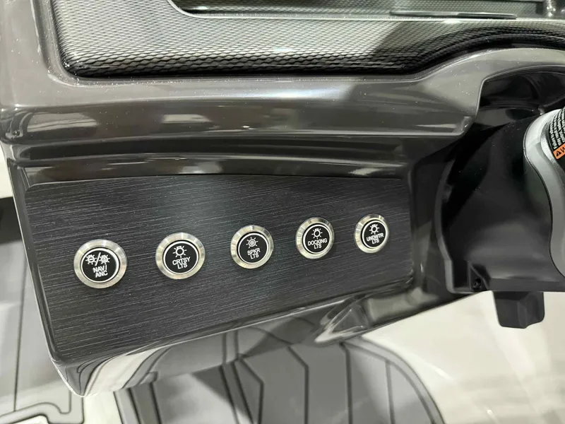 Slide: The Image of Dashboard controls of 2025 Monterey 218 SS boat with various function buttons. - 11