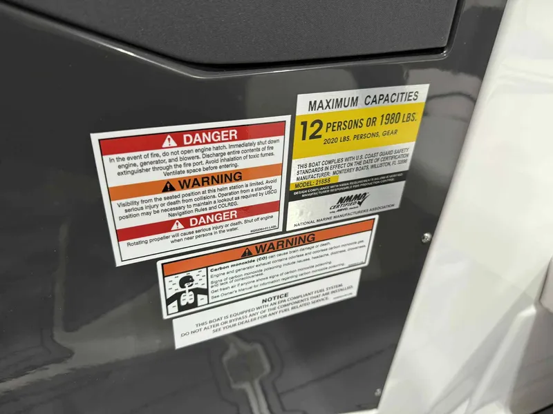Slide: The Image of Warning labels on 2025 Monterey 218 SS boat, maximum capacity 12 persons or 1980 lbs. - 13